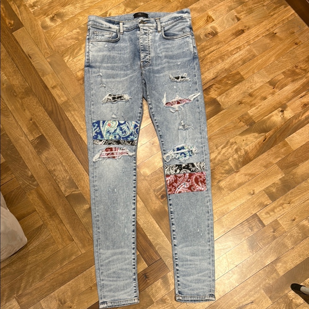 AMIRI Blue Skinny Jeans with Distressed Artistic Design